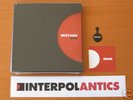 INTERPOL ANTICS 5 x 7