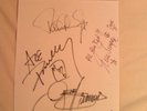 KISS AUTOGRAPHS & GENE SIMMONS SIGNED/WORN TOUR PIECE 