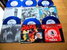 THE POLICE 6 PACK BLUE VINYL PIC SLEEVES +PVC HOLDER