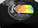 THE YOUNG HOLT TRIO-AIN'T THERE SOMETHING THAT MONEY CAN'T BUY/MELLOW-BRUNSWICK