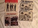 Two 45 rpm Beatles records with jackets plus two jackets from the mid 1960's