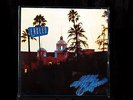 The Eagles: Hotel California, USA 7E1084 1st press in shrink w/ sticker & poster