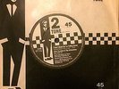 ELVIS COSTELLO-I CANT STAND UP FOR FALLING DOWN TT7 PAPER LABEL EX COND
