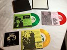 The CRAMPS:OHIO DEMO'S 1979 BOX SET:THREE 45'S-GREEN,RED & YELLOW VINYL:LIKE-NEW