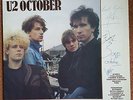 U2 October album authographed by all four band members.