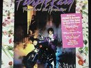 Prince Purple Rain LP in shrink w/ original poster and sleeve. Vinyl is VG++