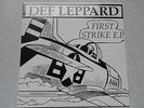 DEF LEPPARD-FIRST STRIKE E.P.  RED VINYL IN MINT CONDITION