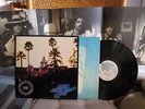 EAGLES HOTEL CALIFORNIA PROMO ROCK LP WITH POSTER ON PROMO ASYLUM 7E-1084