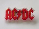 AC/DC LOGO SHAPED PLASTIC PIN BADGE FROM THE 1980's FOR THOSE ABOUT TO ROCK