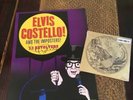 Elvis Costello. Autographed Tour Poster, Sealed Single, VIP Pass and 2nd poster.