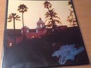 THE EAGLES  HOTEL CALIFORNIA LP NEAR MINT ORIGINAL PRESS WITH INSERT AND POSTER