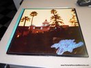 EAGLES HOTEL CALIFORNIA ORIGINAL LP W POSTER, LYRICS, INNER SLEEVE LIKE NEW 1976