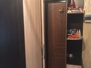 Wardrobe. 2 large divisions with shelves, in the middle a wardrobe on top of a l