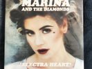 UO Exclusive Electra Heart Pink Vinyl