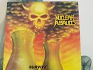 Nuclear Assault ?– Survive - LP record UK 1st 1988 - FLAG 21 - c/w lyric inner
