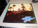 EAGLES HOTEL CALIFORNIA ORIGINAL LP W POSTER, LYRICS, INNER SLEEVE LIKE NEW 1976