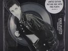 PRINCE: Kiss / Love Or $ 12 (UK, shaped pic disc w/ unused plinth, hype tag on
