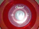 The Beatles 45 record SHE LOVES YOU / I'LL GET YOU, Capitol Cema red vinyl, 1994