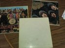 The beatles 1968 white album with poster, Sergeant Peppers, and rubber soul.
