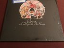 QUEEN - A Day At The Races - 1976 vinyl LP w shrink, hype, and ad for 1976 MSG