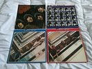 Beatles vinyl albums. Rubber soul, a hard day's night, red album and blue album.