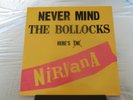 NIRVANA - NEVER MIND THE BOLLOCKS HERES NIRVANA. yellow vinyl L.P. limited (150)