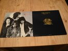 Two original vinyl records, Queen Greatest Hits II and Queen at the Beeb