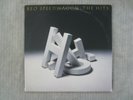 R.E.O. SPEEDWAGON   THE HITS  VINYL RECORD LP / 1988...RIDIN' THE STORM OUT