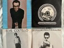 Elvis Costello – Grab 3 (First four singles in a plastic pack) Stiff Records