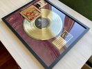 Steely Dan Can't Buy A Thrill Framed Gold Vinyl Record On Red Velvet Background
