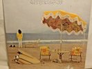 BEAUTIFUL ALBUM ON THE BEACH: BY NEIL YOUNG USA.1974 BY WARNER BRO. R 2180
