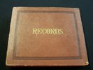 Vintage 1960s BEATLES 45s RECORDS in records book.