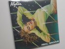 KYLIE MINOGUE  -  REAL GROOVE  -  GREEN VINYL 7” IN PICTURE COVER WITH INNER