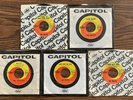 FIVE 45s OF THE BEATLES WITH CAPITOL SLEEVES HELP HARD DAYS NIGHT HOLD YOUR HAND