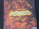 Artifacts Between A Rock And A Hard Place vinyl records