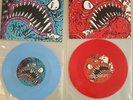 Mega rare, UK Subs double pack red+blue vinyl pledge singles,fully autographed.