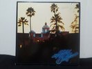 The Eagles Hotel California Vinyl Record 1976 7E-1084 with poster