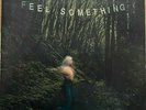 Movements FEEL SOMETHING on Orange colored vinyl