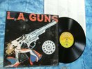 L.A. GUNS - COCKED & LOADED LP in SHRINK + LYRICS   1989 record club NO bar code