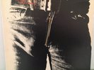 THE  ROLLING  STONES           LP     STICKY FINGERS  (  METAL ZIPPER )