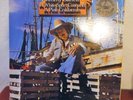 VINTAGE 1981 JIMMY BUFFET ALBUM,WHITE SPORT COAT AND A PINK CRUSTATION