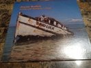 JIMMY BUFFETT Living and Dying in 3/4 Time (MCA Records, 1980s)