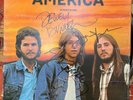 America Homecoming. Vinyl, SIGNED by the band.   NICE  Great Condition  1972.