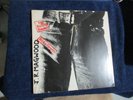 Vinyl LP 1971 original Rolling Stones Sticky Fingers , complete but marred .