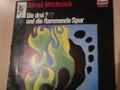 Drei Fragezeichen Flammende Spur Vinyl  LP Hitchcock-Logo
