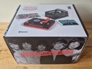 (RSD26) Rolling Stones RSD3 Turntable with Crate and Six 3-Inch Singles in hand